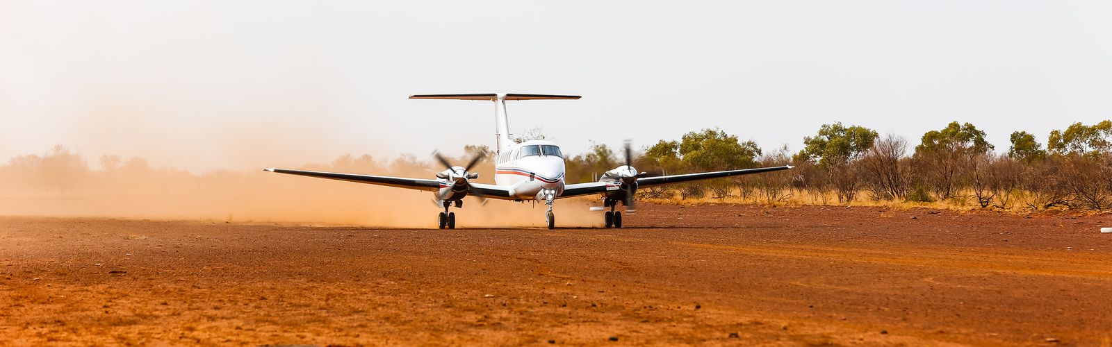 RFDS (Queensland Section) aircraft landing on dirt runway