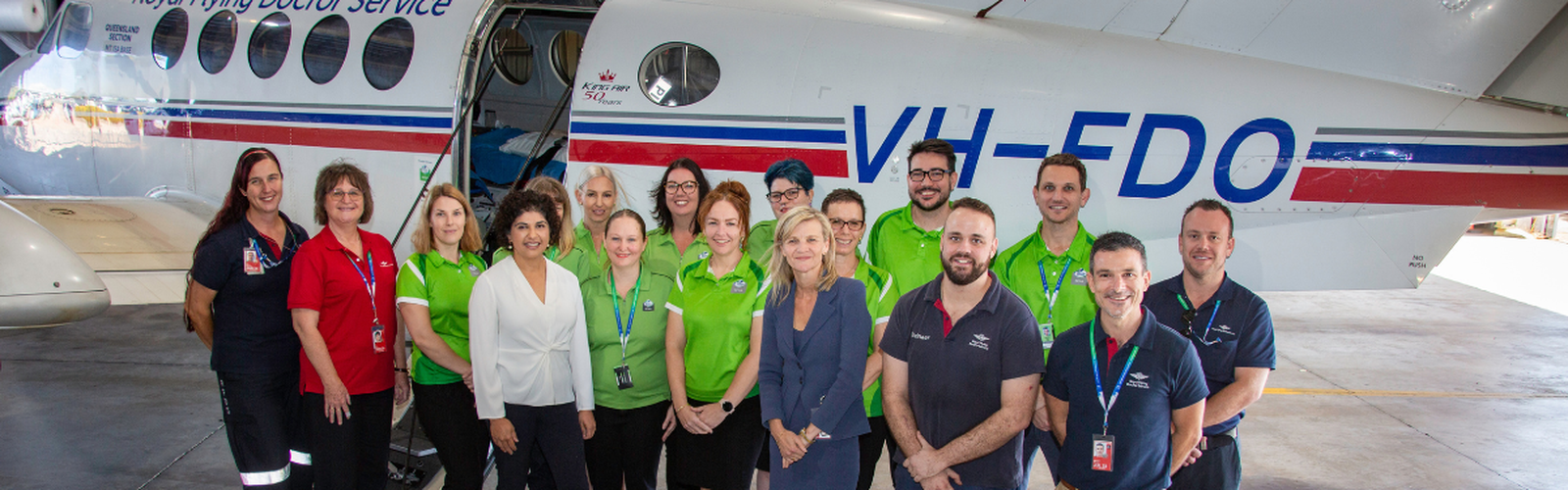 Ergon Energy Retail and RFDS staff in front of aircraft