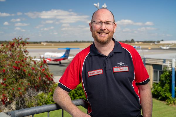 Dan smiling with a PC-12 in the background.