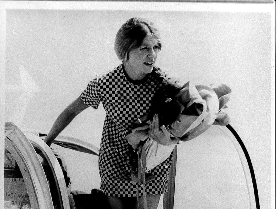 Sugar Bird Lady On the wing of a plane