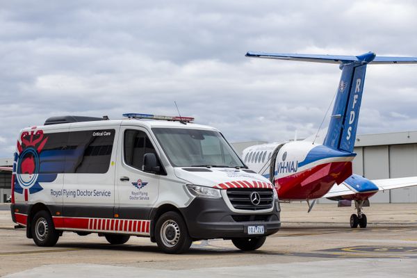 Royal Flying Doctor Service Team in front of their Transport vehicles