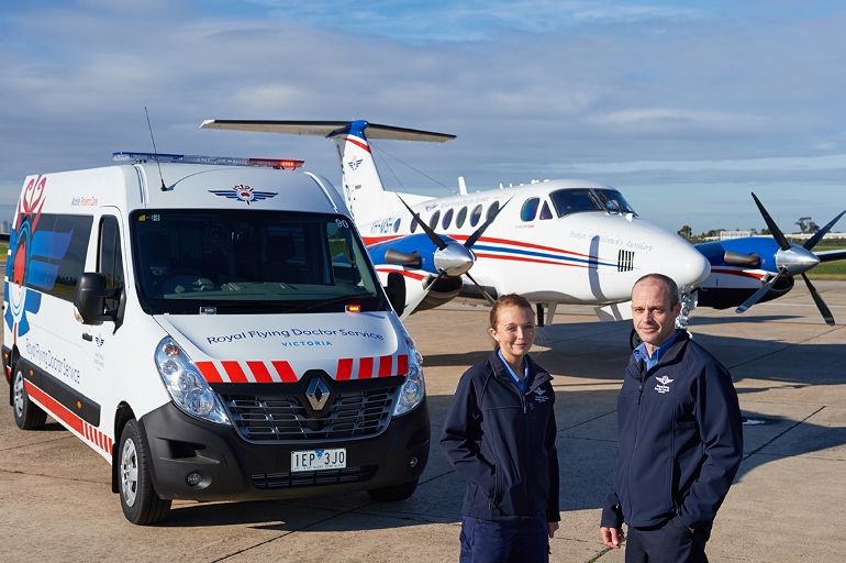 Image of plane, vehicle and two RFDS staff members
