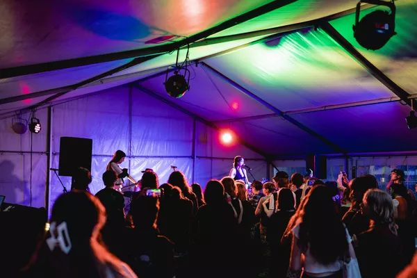 The band Pearly Stars are performing in front of a live audience.