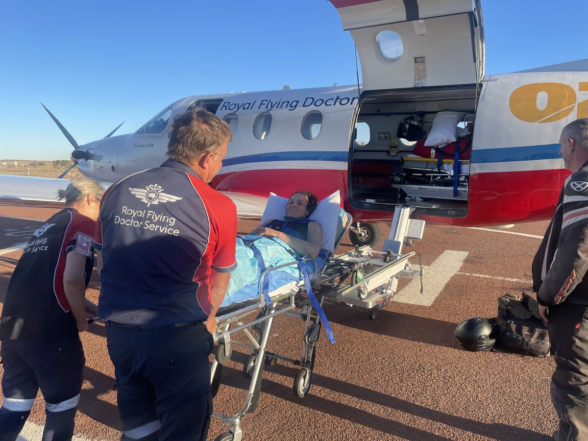Sonia being airlifted by the RFDS from WIlliam Creek in Far North SA.