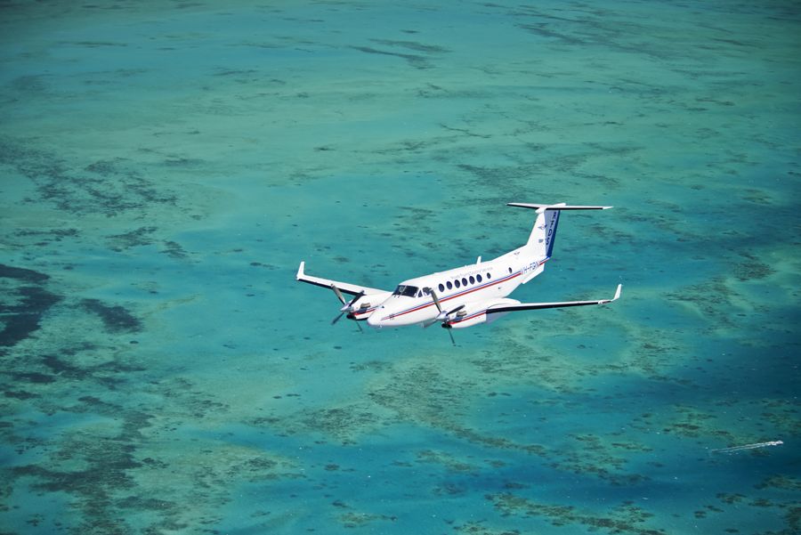 RFDS plane over blue water