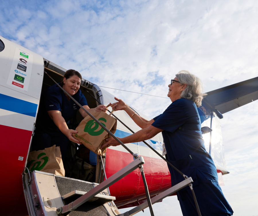 Woolworths bags loaded on the plane