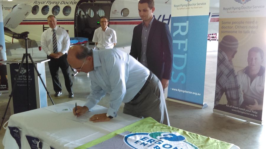 RFDS (Queensland Section) CEO, Nino Di Marco  signs the contract renewal with Ergon Energy Retail.