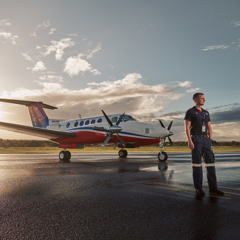 A pilot standing next to an RFDS aircraft