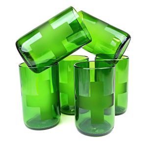 A stack of green glass recycled tumblers with a cross design etched into the side of each glass
