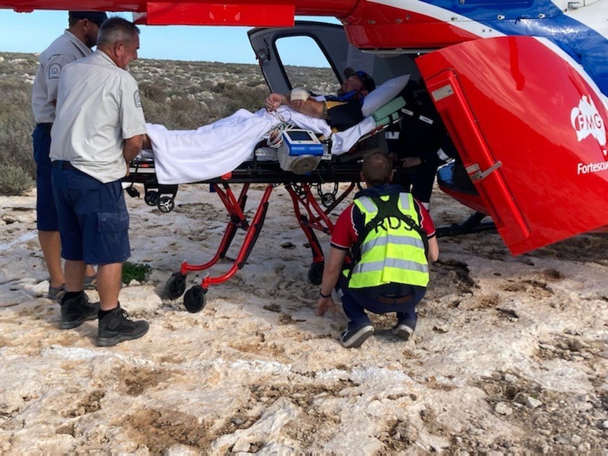 Justin being loaded onto the heli