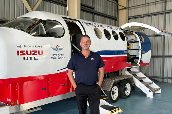 Stuart in front of aeromedical simulator