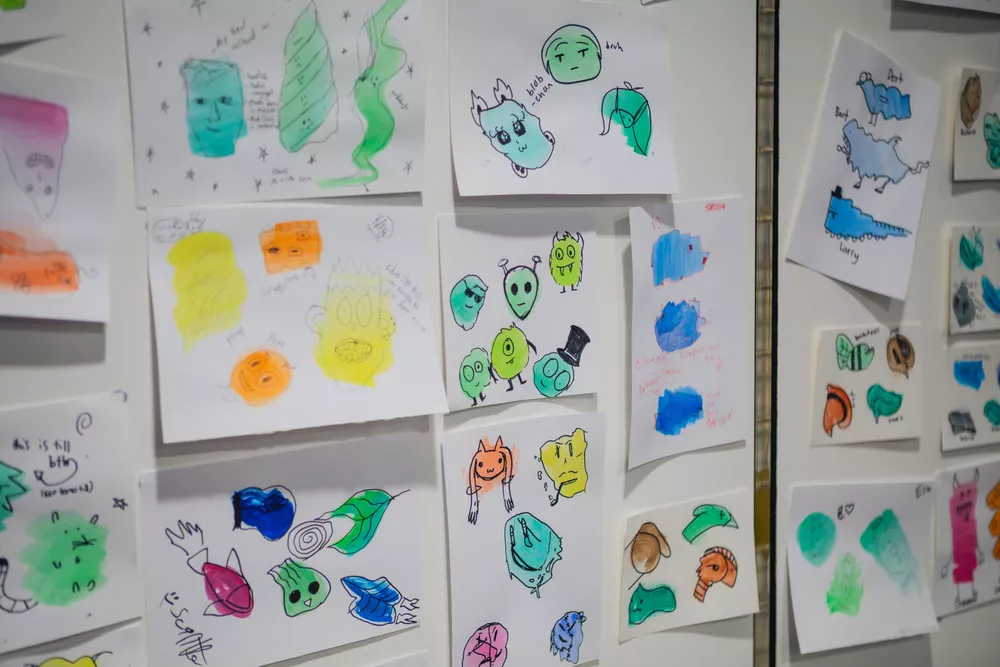 Display of Neo Ambassador activity 'Blob Monsters' stuck up on wall.