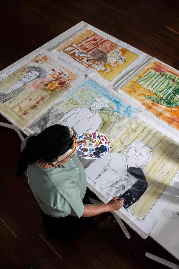 Vera Richards painting portraits of her family in the studio in Galinyala (Port Lincoln)