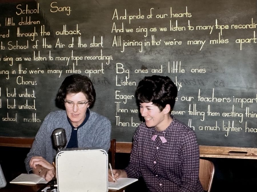 Anne (right) and Miss Morris conducting a School of the Air Broadcast to 5-12 year old students.