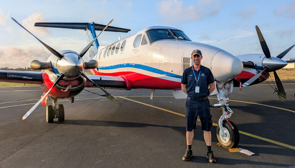 Matthew in front of aircraft 