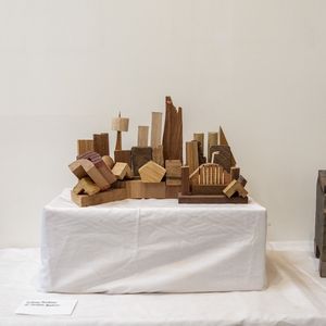 A sculpture of the Opera House made of wooden offcuts in natural timber pieces