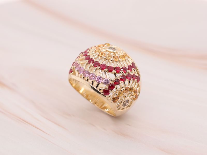 Photo of a heavily jewelled gold ring in a box
