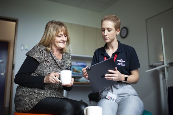 Two women talking in an office
