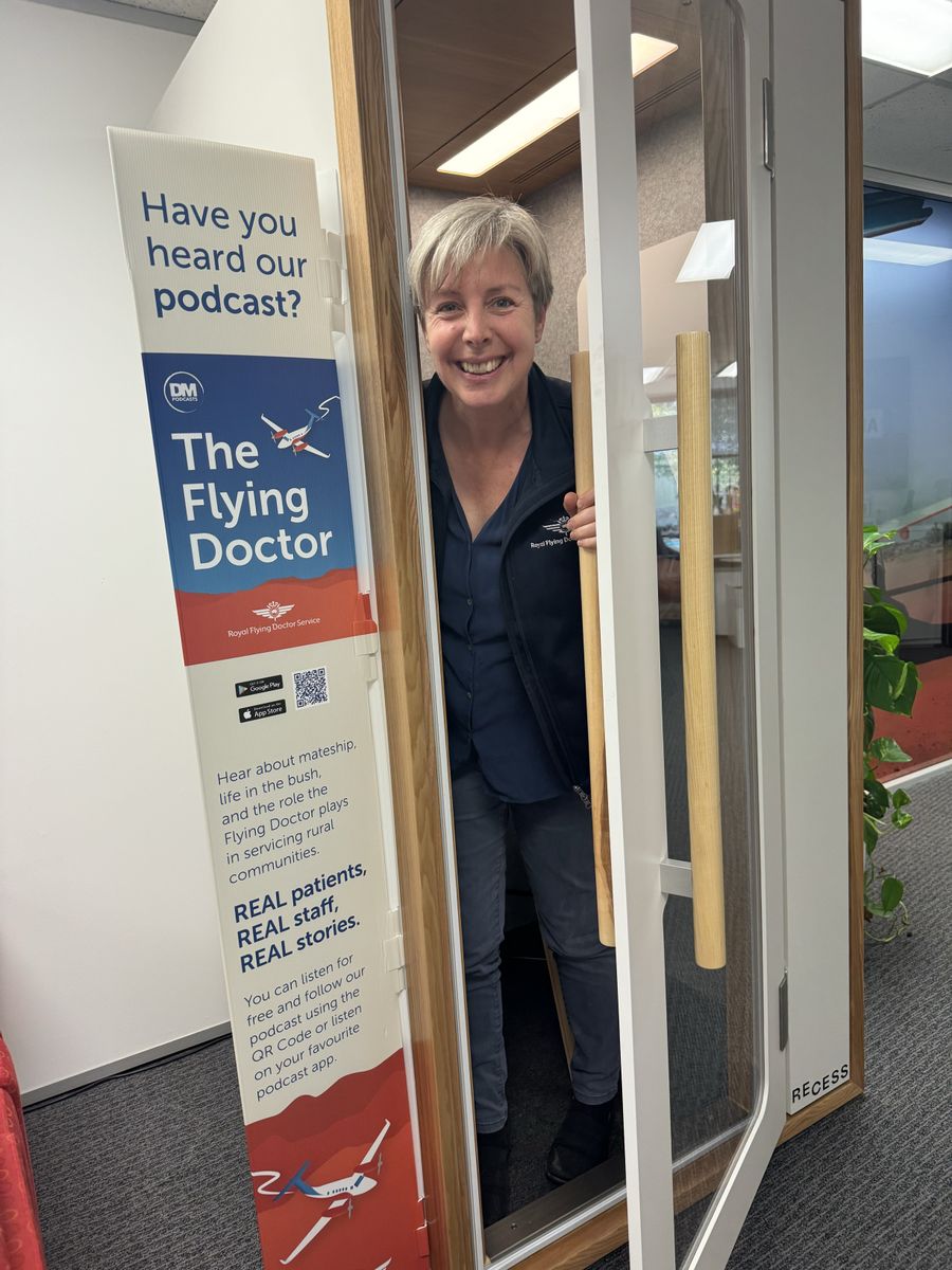 Lana Mitchell near the podcast pod