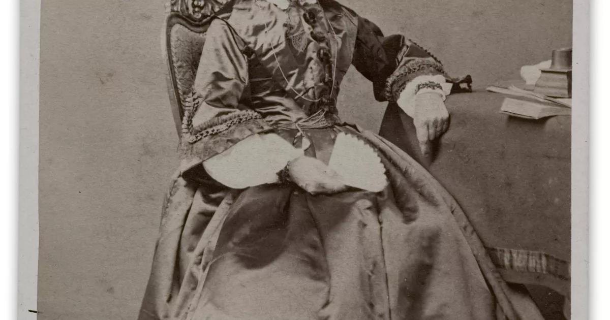 Portrait of woman, open fan in hand - AGSA Collection