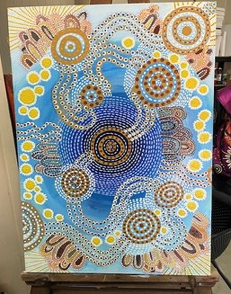 Aunty Joyce Crombie donating the artwork to the RFDS.