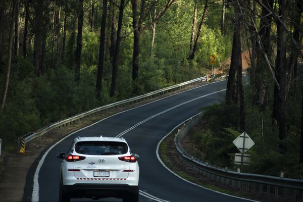 An RFDS car driving along a road in Gippsland