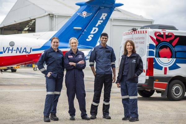 Royal Flying Doctor Service Team in front of their Transport vehicles