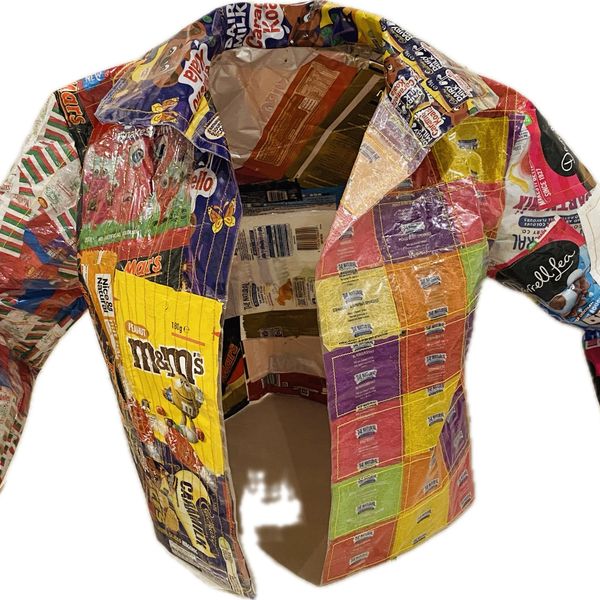 A jacket made out of chip packets on a white background