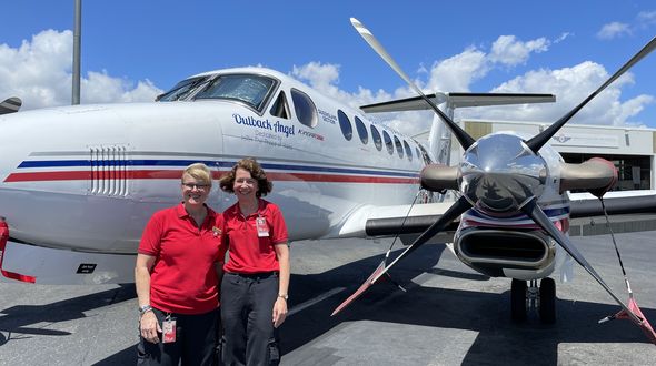 Susan Markwell and Maree Cummins with an RFDS aircraft