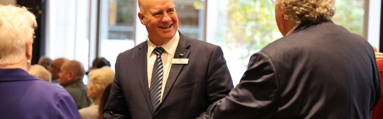 RFDS Victoria Chief Executive, Scott Chapman speaks before a podium at the Going The Distance Gala Dinner.