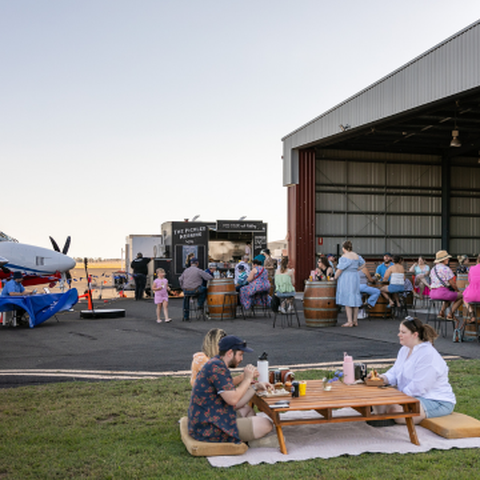 People at the RFDS Roma base having a picnic on the grass