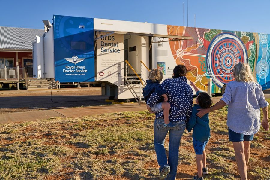 family visiting mobile dental unit 
