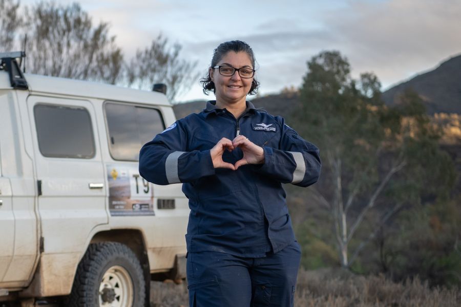 Flight Nurse Lydia Newton with hands in a heart shape