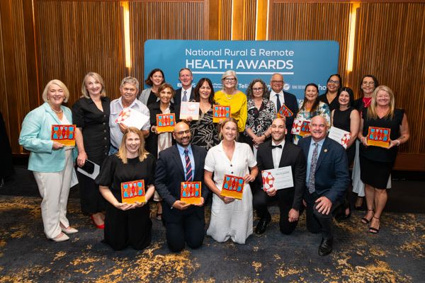 The RFDS team accepting awards in Canberra