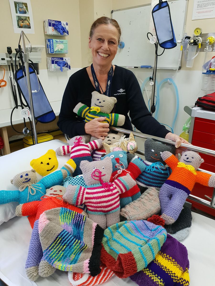 Trish Thompson with gifted knitted toys