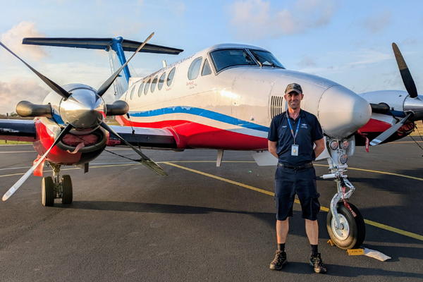 Matthew in front of aircraft 