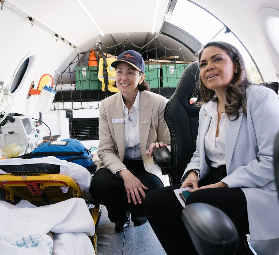 RFDS Federation CEO Emma Buchanan is pictured showing Senator Jacinta Nampijinpa Price inside an RFDS Flight Simulator