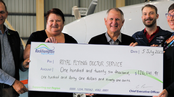RFDS receiving cheque from Rockhampton Regional Council 