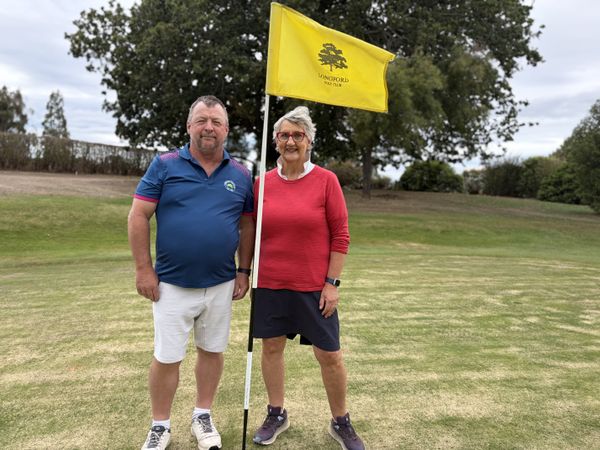 Club captain Craig Richards and member Mandy Burbury on course at Longford.