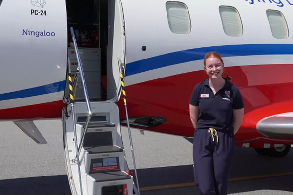 RFDS Tas Robin Miller Scholarship recipient Tessa Mitchell in front of RFDS aircraft