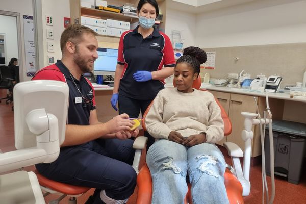 Dentist Michiel De Beer and Dentist Alexandra Dreher with a patient