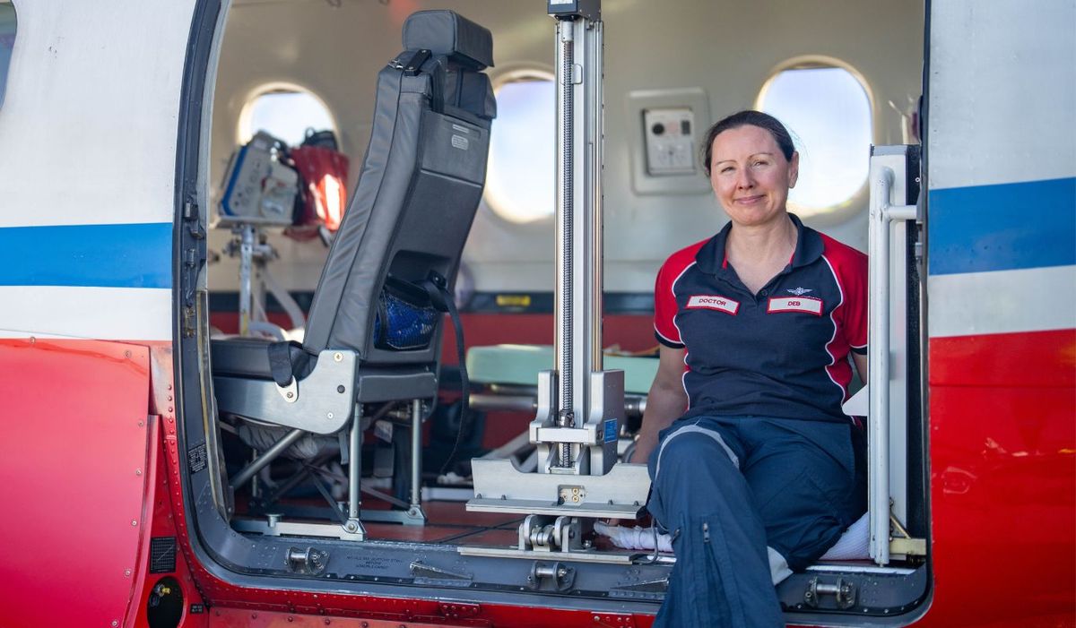 Dr Deb sitting on the edge of a PC-12