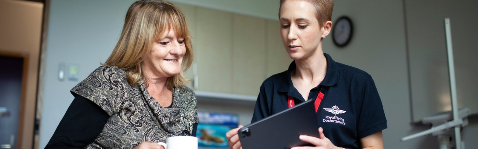An RFDS employee speaks with a client