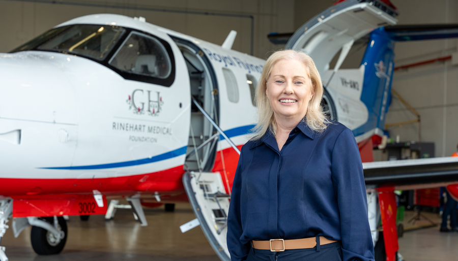 RFDS WA CEO Judith Barker ASM standing beside the new Pilatus PC-12 PRO aircraft