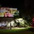 photo of collage projected on wall in forecourt after dark