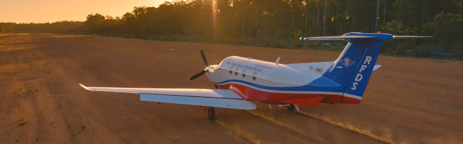 PC-12 on a dirt airstrip