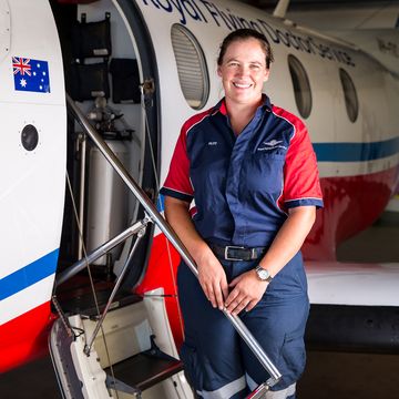 Female pilot in uniform smiling