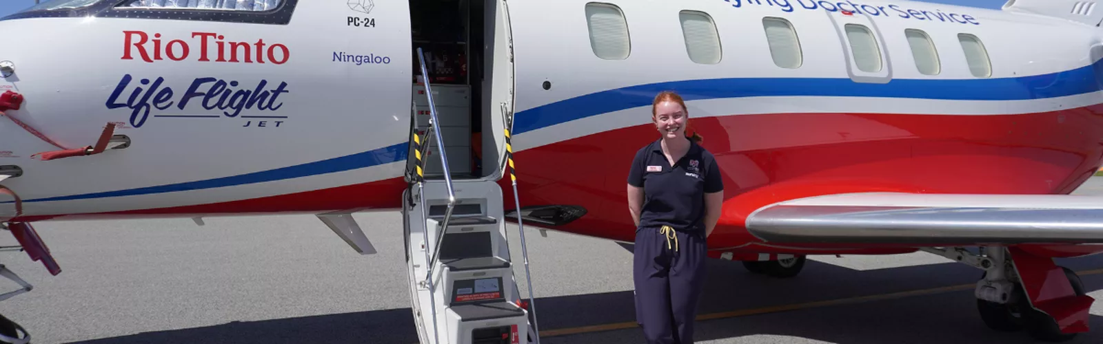 RFDS Tas Robin Miller Scholarship recipient Tessa Mitchell in front of RFDS aircraft
