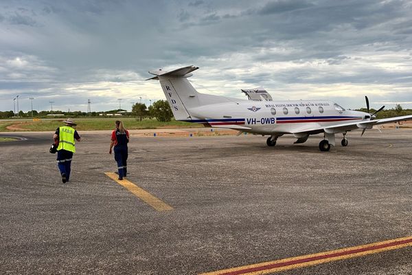 rfds wa pilot and nurse walk out to PC12aircraft at broome base