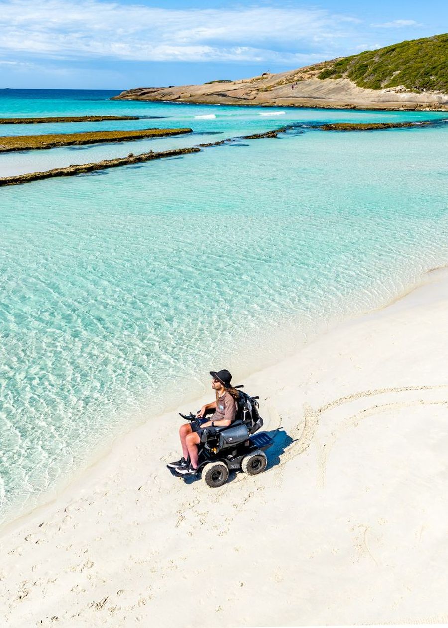 Jaimen travelling across the beach looking at the ocean.